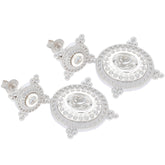 Elegant oval white moissanite sterling silver earrings showcasing stunning brilliance and intricate detailing.